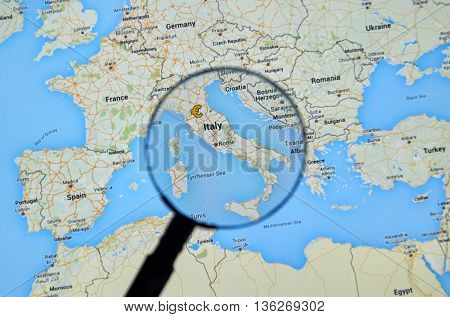 MONTREAL CANADA - JUNE 24 2016 - Italy on Google Maps app under magnifying glass. Italy is a european country and a member of EU.