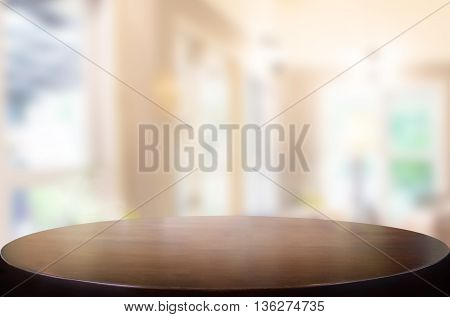 Selected focus empty brown wooden table and Coffee shop blur background with bokeh image. for your photomontage or product display