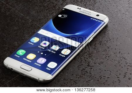 Koszalin, Poland  June 29, 2016: Photo of Samsung Galaxy S7 Edge white pearl. Samsung 7 Edge are new generation smartphone from Samsung. The Samsung S7 Edge is smart phone with multi touch screen