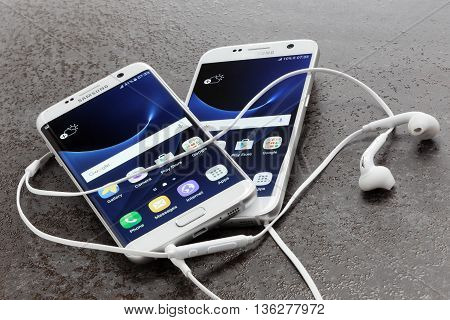 Koszalin, Poland  June 29, 2016: Photo of Samsung Galaxy S7 Edge white pearl. Samsung 7 Edge are new generation smartphone from Samsung. The Samsung S7 Edge is smart phone with multi touch screen