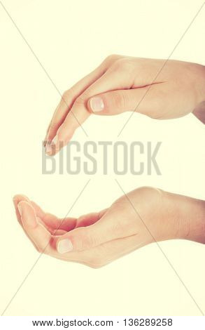 Female's hands in a roung shape.