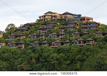 Bungalow on a hill, Hotel of several separate houses, located on different levels. Standing on the mountain near the sea in the jungle.