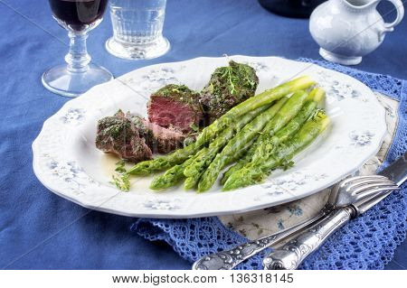 Medaillons with Green Asparagus on Plate