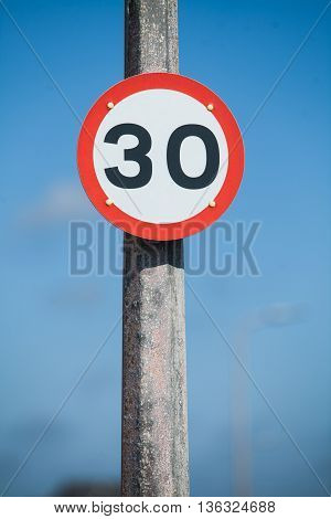 Color image of a 30km/h speed restriction road sign.