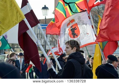 VILNIUS, LITHUANIA - MAR 11: Around one thousand people gathered with flags in a nationalist rally at Rotuses Square on Re-Establishment of Independence Day on March 11, 2014 in Vilnius, Lithuania