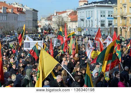 VILNIUS, LITHUANIA - MAR 11: Around one thousand people gathered with flags in a nationalist rally at Rotuses Square on Re-Establishment of Independence Day on March 11, 2014 in Vilnius, Lithuania