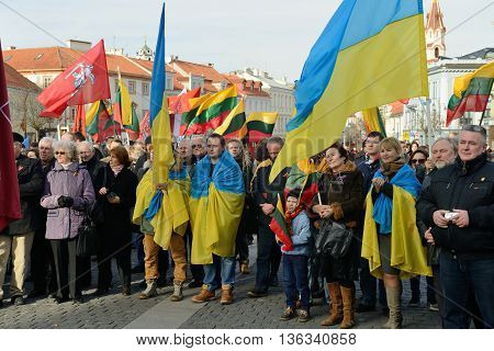 VILNIUS, LITHUANIA - MAR 11: Around one thousand people gathered with flags in a nationalist rally at Rotuses Square on Re-Establishment of Independence Day on March 11, 2014 in Vilnius, Lithuania
