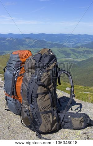 Camping with backpacks in the mountains with views of the mounta