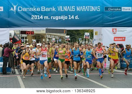 VILNIUS LITHUANIA - SEPTEMBER 14: Runners on start of 11th Danske Bank Vilnius Marathon on 14 September 2014 in Vilnius Lithuania. Vilnius Marathon became a member of AIMS in 2007.