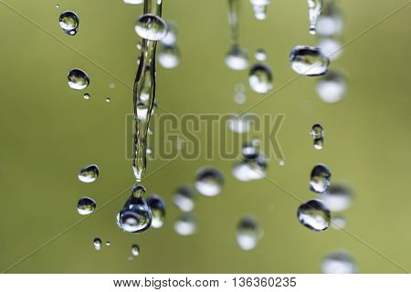 Falling drops in outdoor. Shallow depth of field.