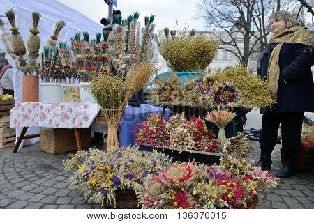 VILNIUS, LITHUANIA - MARCH 8: Unidentified people trade traditional palm bouquets in annual traditional crafts fair - Kaziuko fair on Mar 8, 2014 in Vilnius, Lithuania