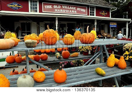Bird-in-Hand Pennsylvania - October 14 2015: Pumpkins gourds and Chrysanthemums are for sale at the Old Village Hardware Store