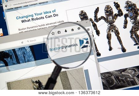MONTREAL CANADA - JUNE 24 2016 : Boston Dynamics web page under magnifying glass. Boston Dynamics is the leading provider of human simulation software tools and solutions.