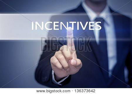 Businessman hand touching INCENTIVES button on virtual screen