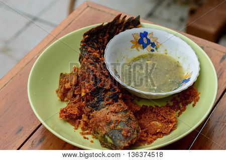 Deep fried catfish with turmeric  and Seafood sauce