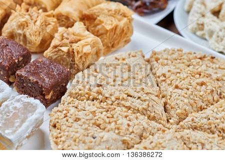 Oriental sweets on a white plate. Turkish or greek delight
