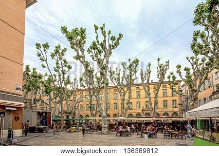 People Enjoy The Spring At The Place De Richelme In Aix-en-provence