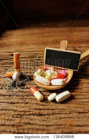 concept ideas of healthy stop smokingcigarette with medicine on woodenbad health