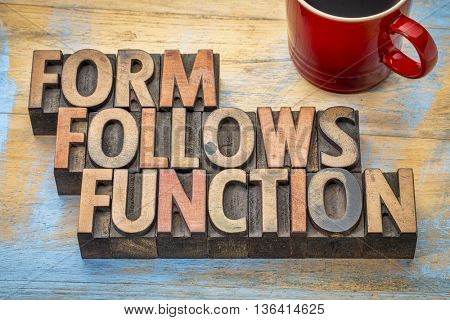 Form follows function - design concept - text in vintage letterpress wood type printing blocks with a cup of coffee