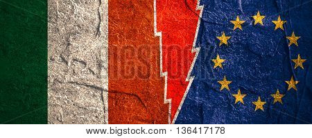 Image relative to politic relationships between European Union and Italy. National flags divided by high voltage sign. Concrete textured