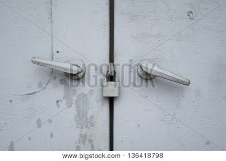Gray steel cabinet doors is lock it have gray color