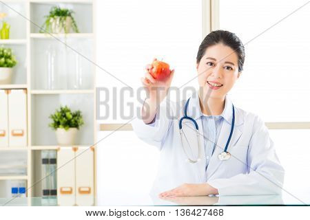 Young Asian Nutritionist Holding An Apple