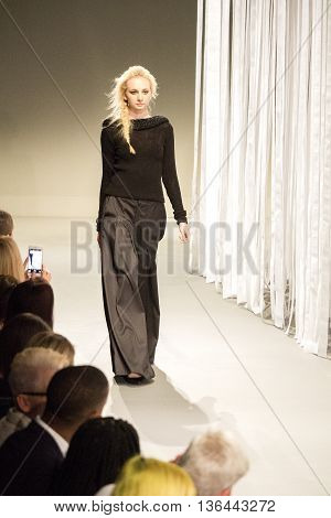 Johannesburg, South Africa - October 23, 2015: Model walking by runway. South African Fashion Week. Collection by ERRE. Catwalk. Hotel Crowne Plaza.