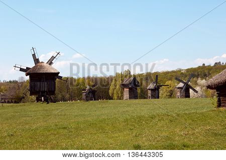 Landscape with old windmill in the village Pirogovo, Ukraine. Eastern Europe. Artistic retouching.
