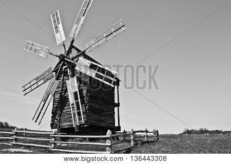 Landscape with old windmill in the village Pirogovo, Ukraine. Eastern Europe. Black and white image.