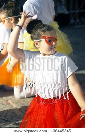 Montenegro, Herceg Novi - 04/06/2016: The girl in the masquerade mask dances. 10 International Children's Carnival in Herceg Novi