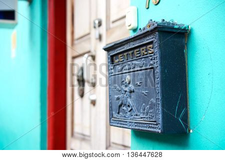 unique mail letter box against the wall
