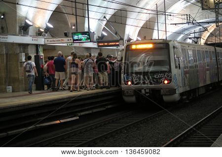 Rome Italy 17 June 2016. Passengers boarding metro at Termini station. Roma Termini is the main railway station.