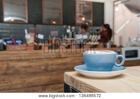 Coffee On A Table In A Busy Cafe
