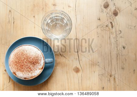 Fresh Cup Of Coffee On A Wooden Table Background In The Cafe