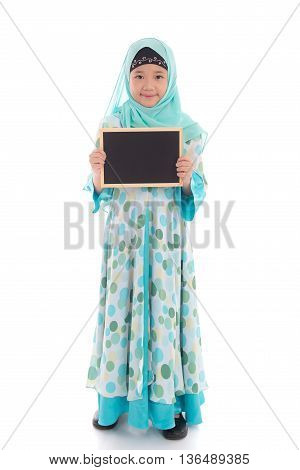 Portrait of asian muslim girl holding blackboard on white background isolated