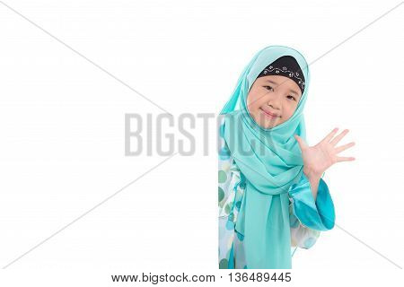 Portrait of asian muslim girl with an empty banner on white background isolated