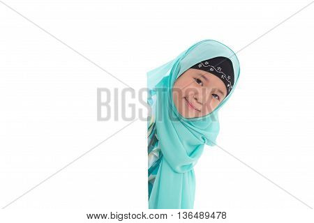 Portrait of asian muslim girl with an empty banner on white background isolated