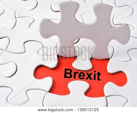 Brexit on missing puzzle concept on red background