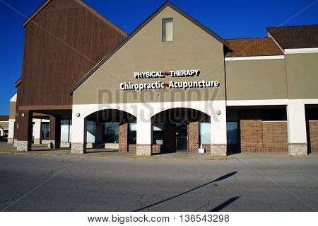 NAPERVILLE, ILLINOIS / UNITED STATES - NOVEMBER 3, 2015: One may obtain physical therapy, chiropractic, and acupuncture treatments at an office in a Naperville strip mall.