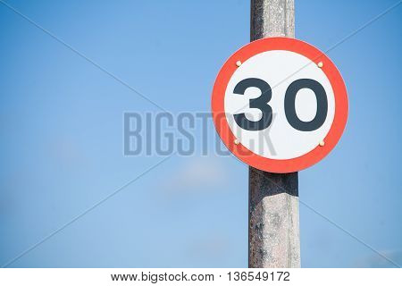 Color image of a 30km/h speed restriction road sign.