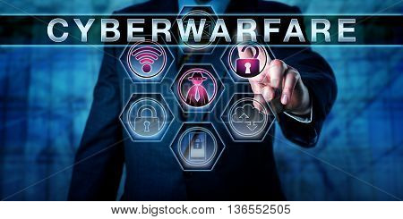 Torso of a businessman in blue suit is reaching with his left hand to activate the technical term CYBERWARFARE. An opened padlock a black hat hacker and a wireless symbol are lighting up in purple.