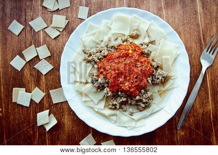 Khinkal, A Traditional Dish Of Caucasian Cuisine, Boiled Pieces Of Dough With Meat And Tomato Sauce