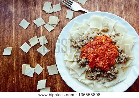 Khinkal, A Traditional Dish Of Caucasian Cuisine, Boiled Pieces Of Dough With Meat And Tomato Sauce