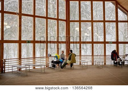 MOSCOW REGION, RUSSIA - DEC 28, 2014: People take rest in wooden house at Sports complex Stepanovo. Sports complex Stepanovo is located 50 km from Moscow.