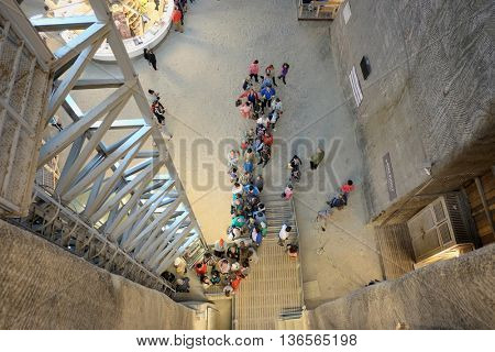 TURDA, ROMANIA - AUGUST 10, 2015: many people in line to take the elevator of Salina Turda a salt mine turned into a underground tourist attraction 