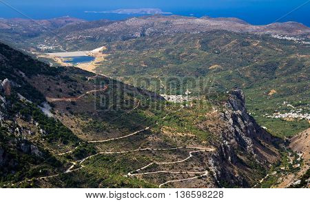 Mountains of the island of Crete and winding road. The view from the pass