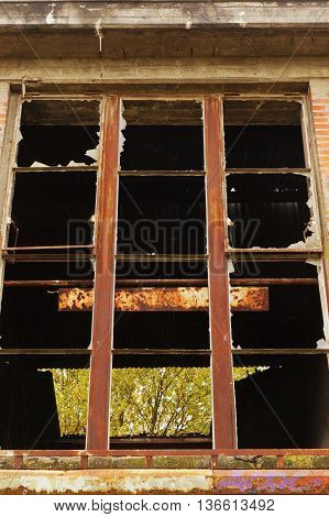 Destroyed window at an old abandoned building