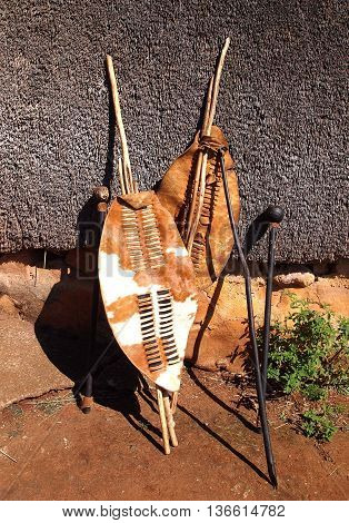 Close-up South African Zulu spears warrior leather shields and assegai. Traditional tribal ethnic weapon.