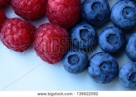 Closeup Of A Bunch Of Raspberries And Blueberries