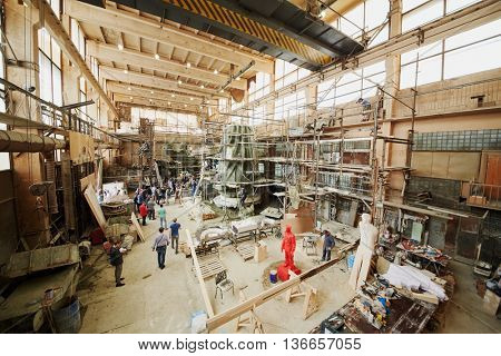 RUSSIA, MOSCOW - MAY 28, 2015: Press representatives and studio employees near clay sculpture to St. Prince Vladimir during manufacture in the workshop of sculptor Salavat Shcherbakov.